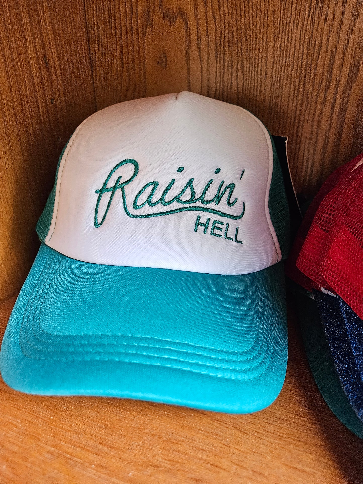 Raisin’ Hell Trucker Hat – Embroidered Funny Hat in Multiple Colors