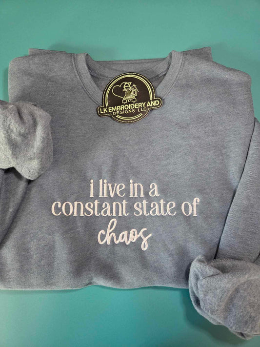 i live in a constant state of chaos Embroidered Crewneck Sweatshirt