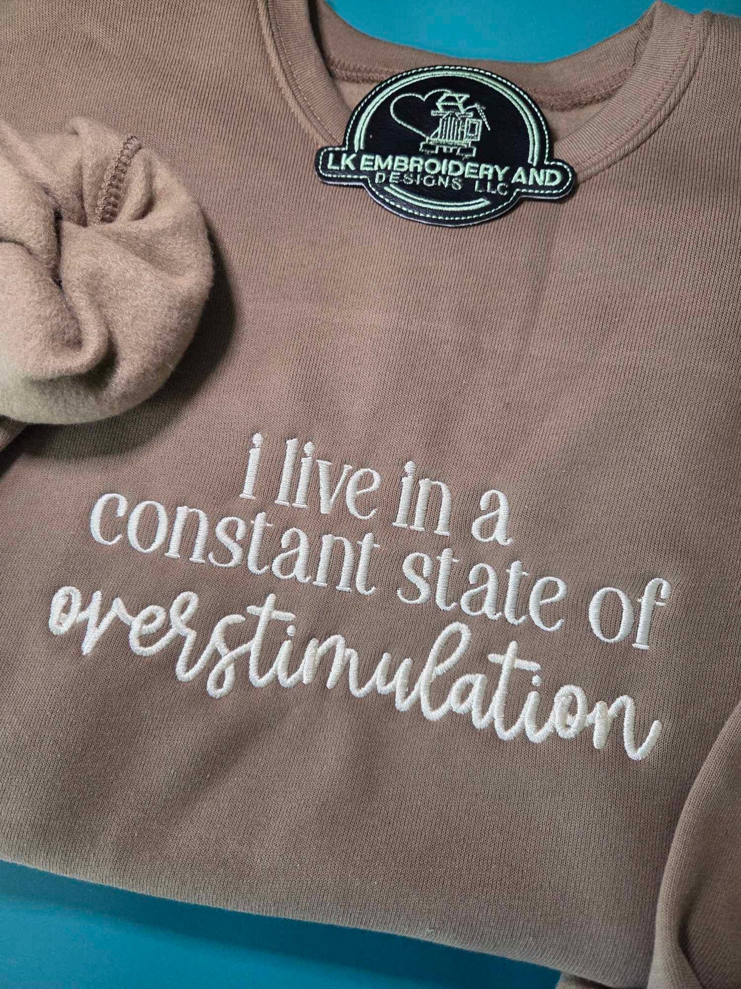 i live in a constant state of overstimulation Embroidered Crewneck Sweatshirt