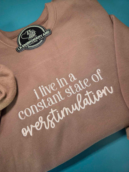 i live in a constant state of overstimulation Embroidered Crewneck Sweatshirt