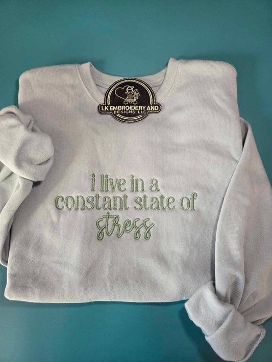 i live in a constant state of stress Embroidered Crewneck Sweatshirt